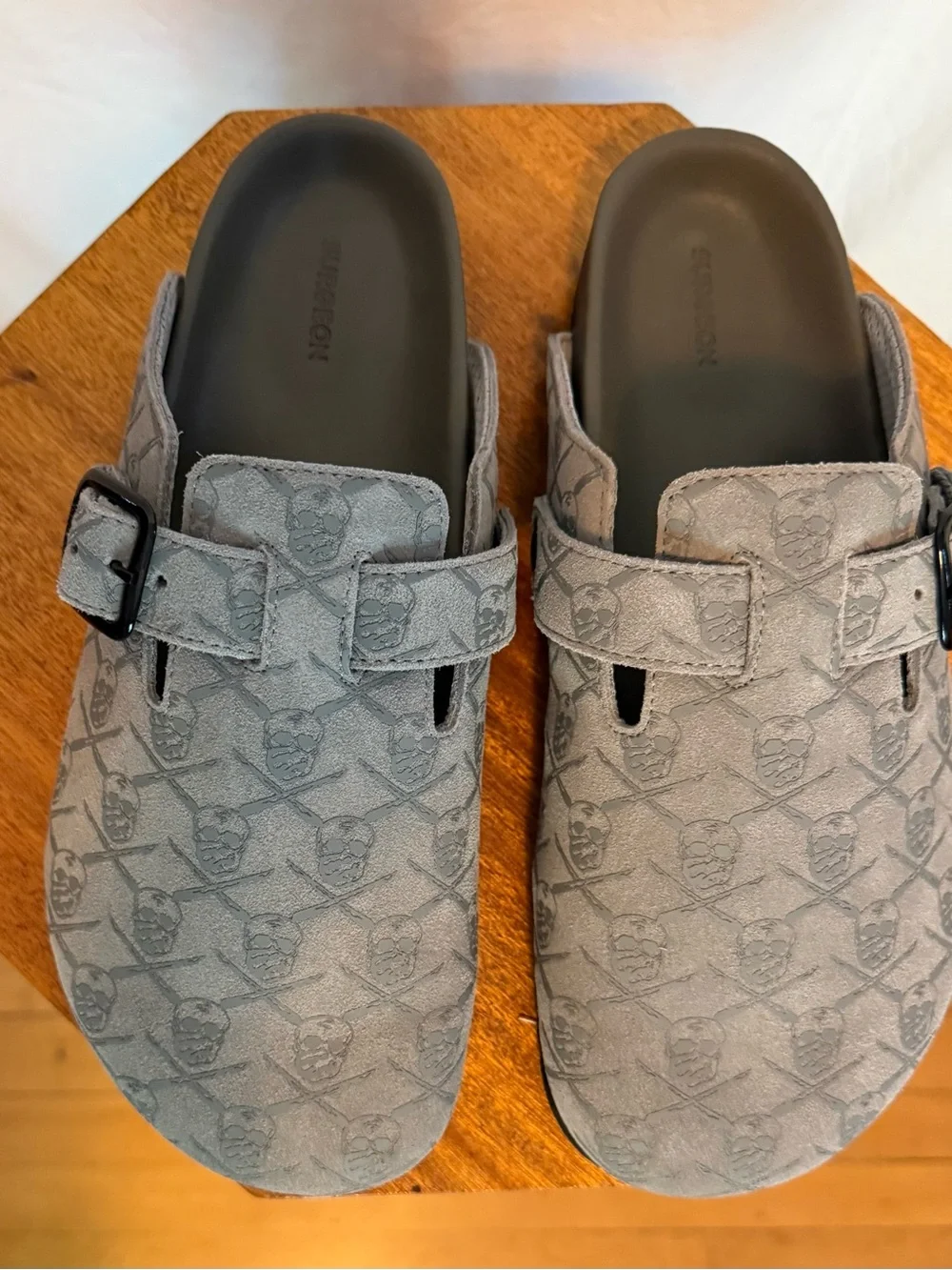 Men's SRGN mule in grey by The Surgeon with skull and crossbones pattern.